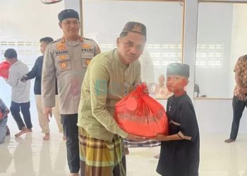 Kapolres Pohuwato Bagi Bantuan Sembako ke Anak Yatim Munzalan