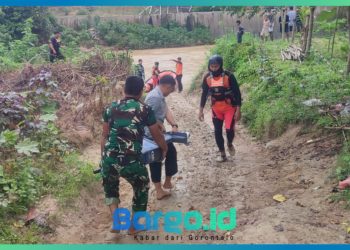 Babinsa Koramil 1313-02/Marisa Turun Langsung Cari Korban Tenggelam di Sungai Pasar Marisa