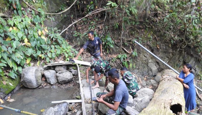 Pemasangan Pipa Program Manunggal Air Bersih TMMD Pohuwato Berlanjut